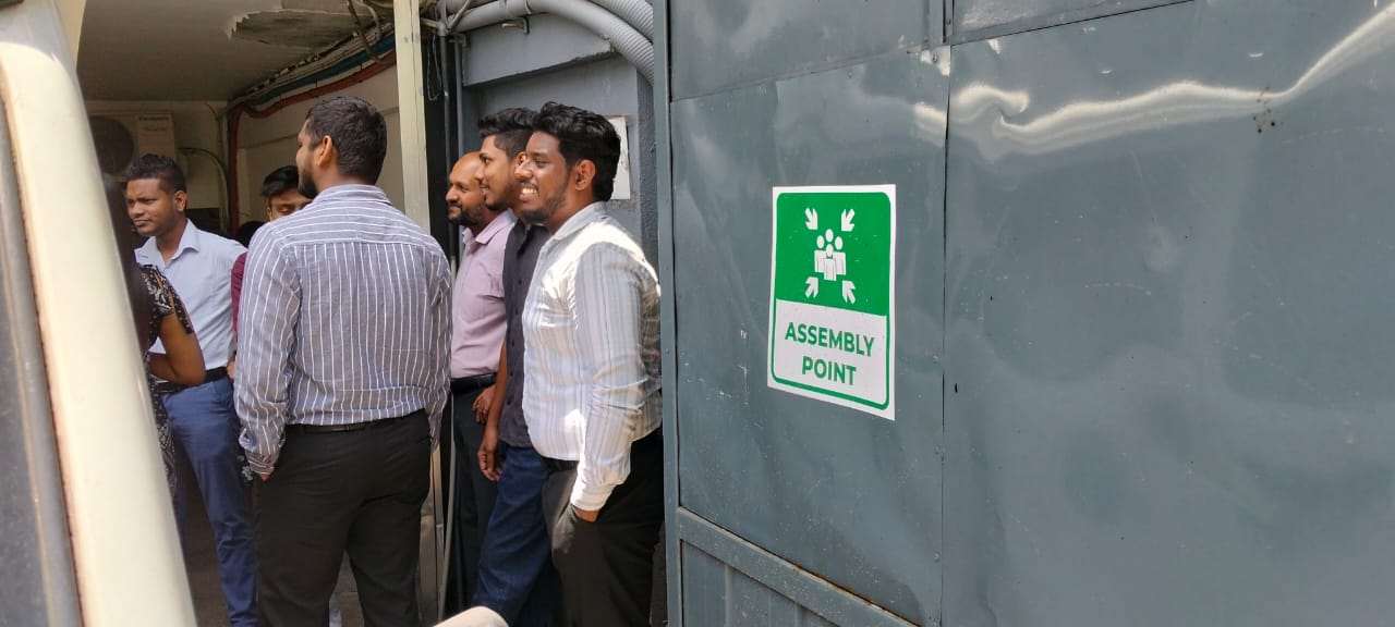Staff at the designated assembly point during fire drill